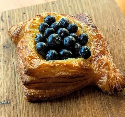 Flaky, golden Blueberry Cream Cheese Danish filled with a rich, creamy sweetened cream cheese filling and piled high with ripe, juicy blueberries.